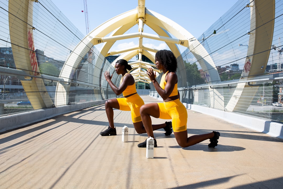 woman-in-yellow-shorts-sitting-on-yellow-chair-zqndcje06vm